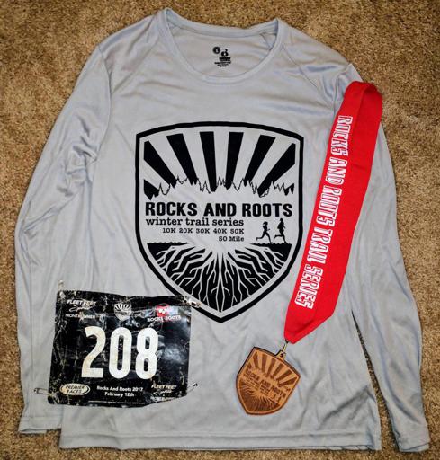 Rocks and Roots 50k shirt and medal