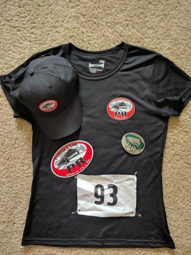 Forget the PR shirt, buckle, hat, sticker, and bib